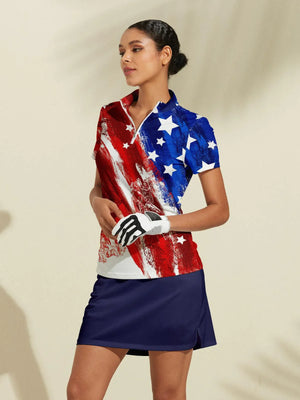 Woman wearing a patriotic USA flag print golf polo and navy blue golf skirt.
