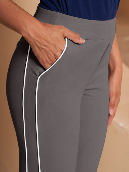 Women's grey performance golf trousers with white side stripe detailing.