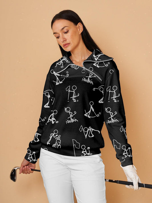 Woman wearing a black patterned women's golf quarter-zip pullover and white golf trousers.