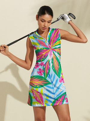 Woman wearing a colorful tropical floral print sleeveless golf dress holding a golf club.
